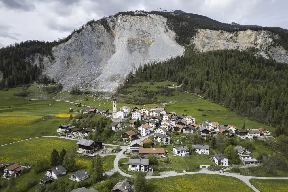 Stragglers pack up as Swiss village is evacuated under rockslide threat