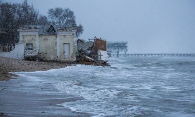 view shows a damaged building on a beach affected by a powerful storm in Yevpatoriya, Crimea. REUTERS/Alexey Pavlishak