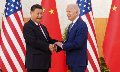 U.S. President Joe Biden shakes hands with Chinese President Xi Jinping as they meet on the sidelines of the G20 leaders' summit in Bali, Indonesia, November 14, 2022. REUTERS/Kevin Lamarque/File Photo