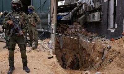 Israeli soldiers stand near the opening to a tunnel at Al Shifa Hospital compound in Gaza City, amid the ongoing ground operation of the Israeli army against Palestinian Islamist group Hamas, in the Gaza Strip, November 22, 2023. REUTERS/Ronen Zvulun