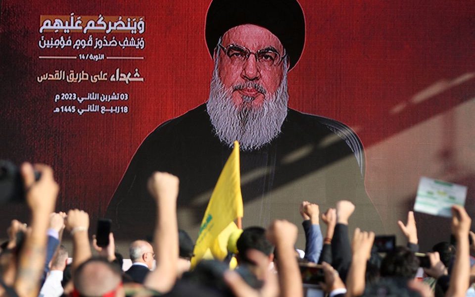 Lebanon's Hezbollah leader Sayyed Hassan Nasrallah appears on a screen as he addresses his supporters during a ceremony to honour fighters killed in the recent escalation with Israel, in Beirut's southern suburbs, Lebanon November 3, 2023. REUTERS/Mohamed Azakir