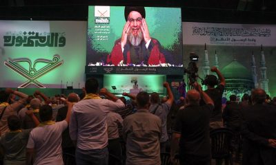 Lebanon's Hezbollah leader Sayyed Hassan Nasrallah addresses his supporters via a screen during a rally marking Prophet Mohammed's birthday, in Beirut suburbs, Lebanon October 2, 2023. REUTERS/Mohamed Azakir/File Photo
