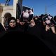 Mourners hold photographs of three Lebanese girls who were killed along with their grandmother in what Lebanese authorities said was an Israeli strike that hit their car on Sunday, as they mourns during their funeral, in the southern town of Blida, Lebanon November 7, 2023. REUTERS/Zohra Bensemra