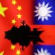 A Navy miniature is seen in front of displayed Chinese and Taiwanese flags in this illustration taken, April 11, 2023. REUTERS/Dado Ruvic/Illustration/File Photo
