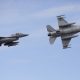 Two Romanian Air Force F-16 perform fly-bys during the inauguration event of the European F-16 Training Center inside the 86th Romanian Airbase, in Fetesti, Romania, November 13, 2023. Inquam Photos/George Calin via REUTERS