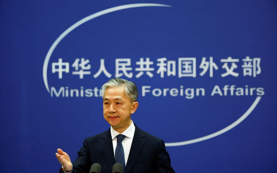 Chinese Foreign Ministry spokesperson Wang Wenbin attends a news conference in Beijing, China March 3, 2022. REUTERS/Carlos Garcia Rawlins/File Photo