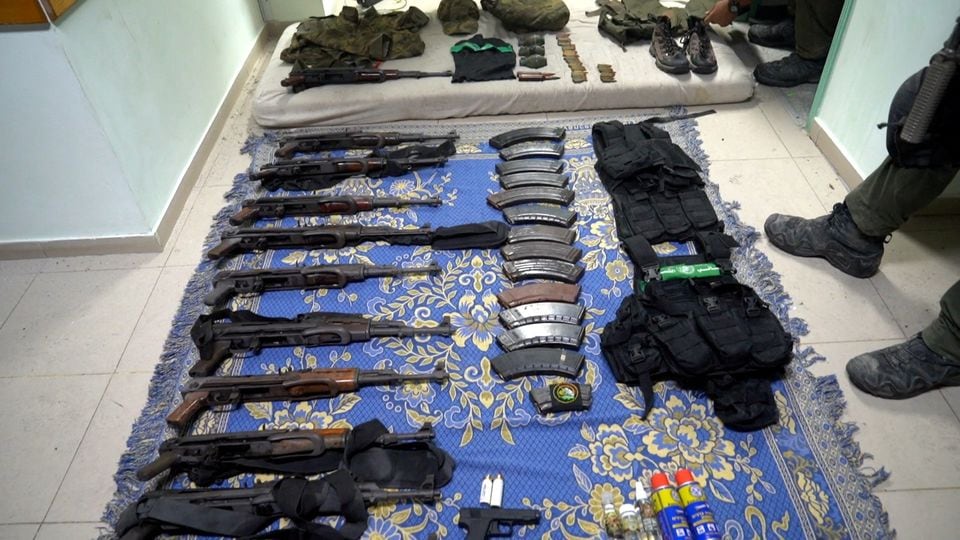 Weapons and equipment which Israel's army says it found at Al Shifa hospital complex in the Gaza Strip, as seen in a handout picture released by the Israel Defense Forces on November 15, 2023. Israel Defense Forces/Handout via REUTERS