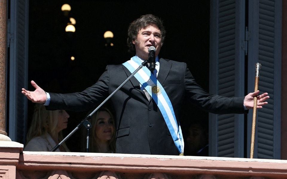 Argentina's President Javier Milei addresses supporters from the Casa Rosada balcony, as his sister Karina Milei and his partner Fatima Florez look on, after his swearing-in ceremony, in Buenos Aires, Argentina December 10, 2023. REUTERS/Agustin Marcarian/File Photo