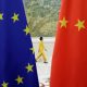 An attendant walks past EU and China flags ahead of the EU-China High-level Economic Dialogue at Diaoyutai State Guesthouse in Beijing, China June 25, 2018. REUTERS/Jason Lee/File photo