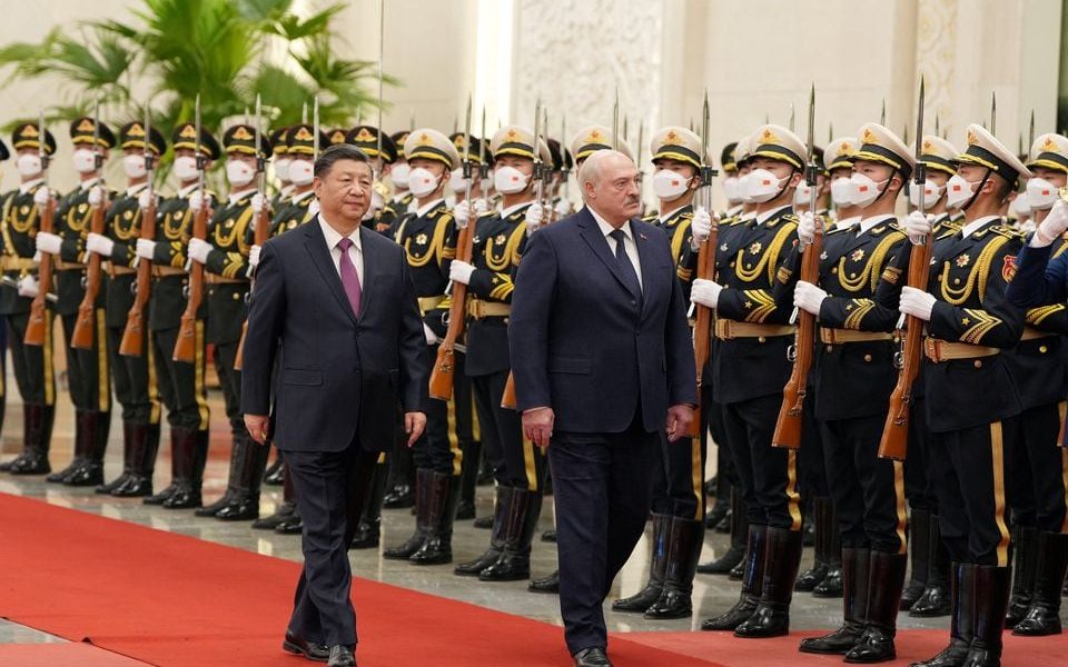 Chinese President Xi Jinping and Belarusian President Alexander Lukashenko review the honour guard during a welcome ceremony at the Great Hall of the People in Beijing, China March 1, 2023. cnsphoto via REUTERS/File photo