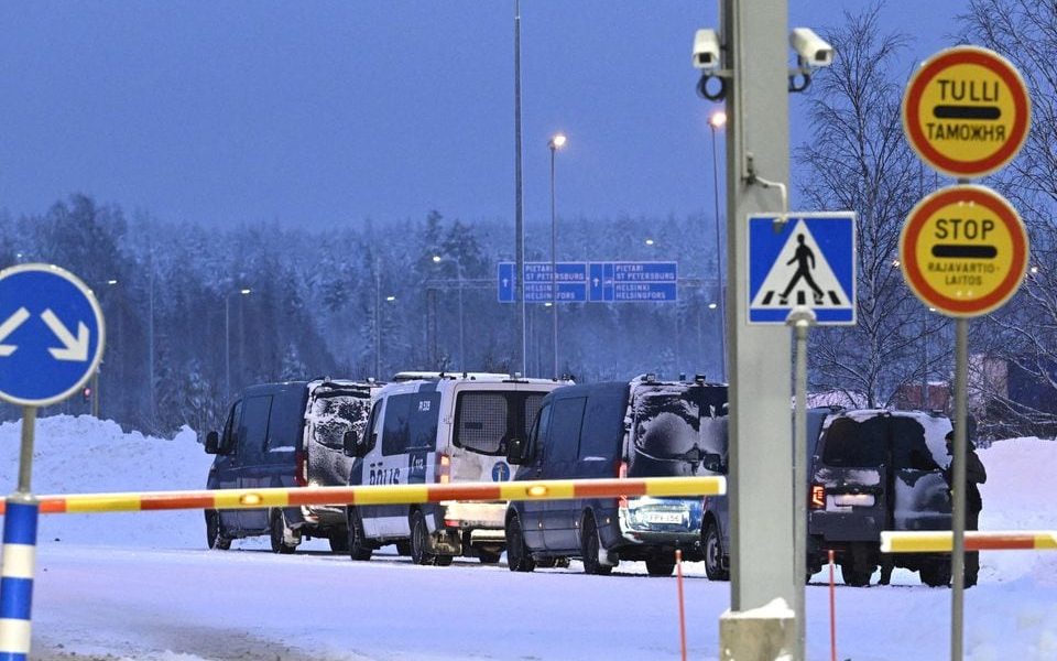 Vehicles of Finnish police are seen parked at the re-opened Vaalimaa border checkpoint between Finland and Russia in Virolahti, Finland December 14, 2023. Lehtikuva / Heikki Saukkomaa/via REUTERS/File Photo