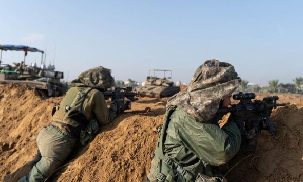 Israeli soldiers operate in the Gaza Strip amid the ongoing conflict between Israel and the Palestinian Islamist group Hamas, in this handout picture released on December 8, 2023. Israel Defense Forces/Handout via REUTERS