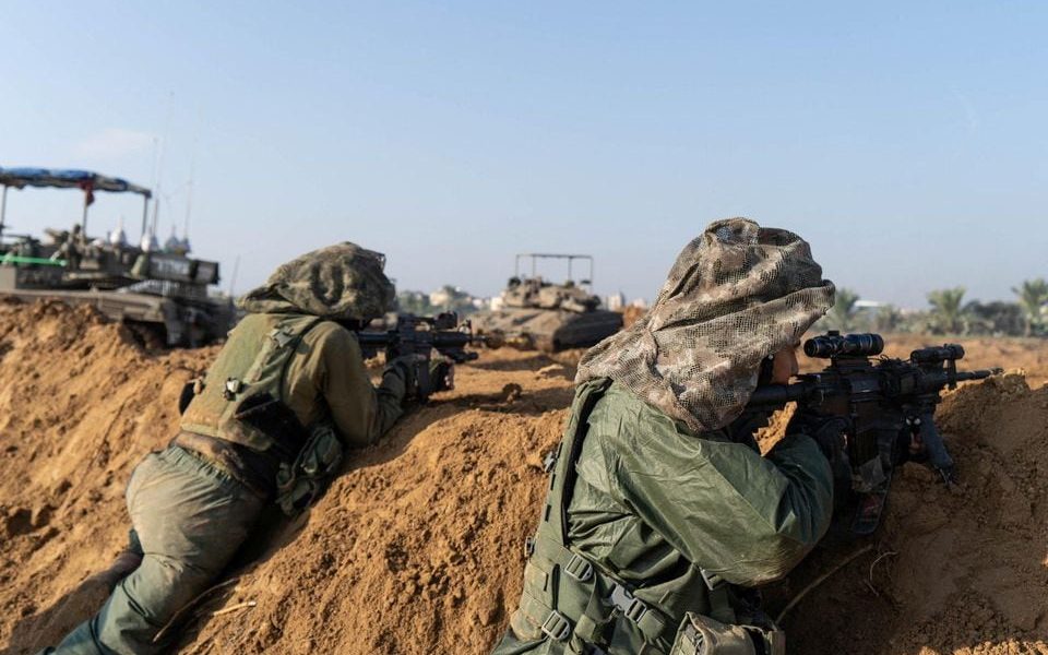Israeli soldiers operate in the Gaza Strip amid the ongoing conflict between Israel and the Palestinian Islamist group Hamas, in this handout picture released on December 8, 2023. Israel Defense Forces/Handout via REUTERS