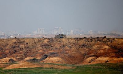 An Israeli tank operates near the Israel-Gaza border, amid the ongoing conflict between Israel and the Palestinian Islamist group Hamas, as seen from southern Israel, December 7, 2023. REUTERS/Athit Perawongmetha