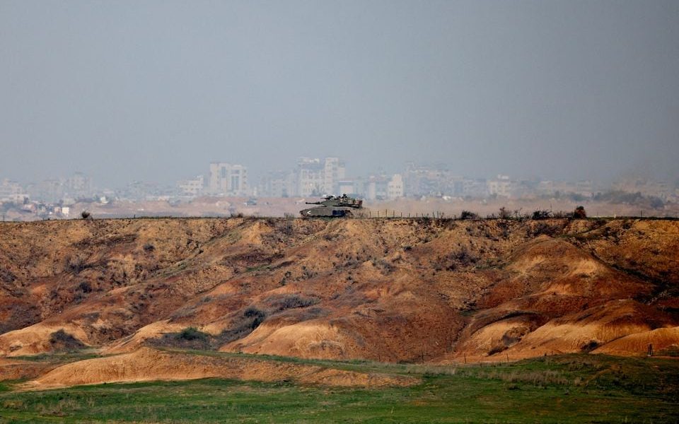 An Israeli tank operates near the Israel-Gaza border, amid the ongoing conflict between Israel and the Palestinian Islamist group Hamas, as seen from southern Israel, December 7, 2023. REUTERS/Athit Perawongmetha