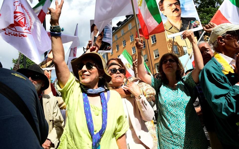 People react to the verdict of the trial of Hamid Noury, a former Iranian prosecution official accused of crimes against international law and murder in Iran in 1988, outside the Stockholm District Court in Stockholm, Sweden July 14, 2022. Noury was sentenced to a lifetime in prison. Chris Anderson/TT News Agency/via REUTERS/File Photo