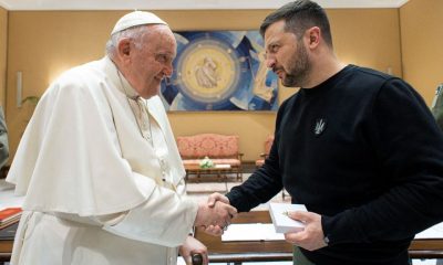 Pope Francis shakes hands with Ukrainian President Volodymyr Zelenskiy, at the Vatican