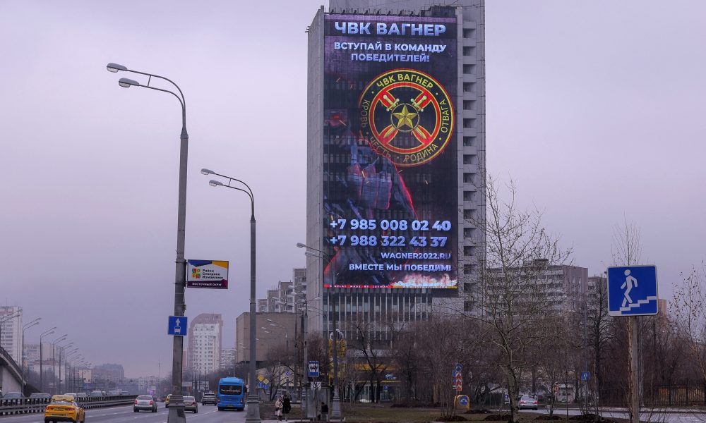 An advertising screen, which promotes to join Wagner private mercenary group, is on display on the facade of a building in Moscow, Russia, March 27, 2023. REUTERS/Evgenia Novozhenina/File Photo