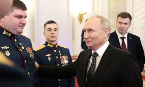 Russia's President Vladimir Putin attends a ceremony to present Gold Star medals to service members, bearing the title of Hero of Russia and involved in the country's military campaign in Ukraine, on the eve of Heroes of the Fatherland Day at the St. George Hall of the Grand Kremlin Palace in Moscow, Russia, December 8, 2023. Sputnik/Valeriy Sharifulin/Pool via REUTERS