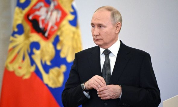 Russia's President Vladimir Putin attends a ceremony to present Gold Star medals to service members, bearing the title of Hero of Russia and involved in the country's military campaign in Ukraine, on the eve of Heroes of the Fatherland Day at the St. George Hall of the Grand Kremlin Palace in Moscow, Russia, December 8, 2023