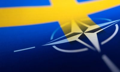 Swedish and NATO flags are seen printed on paper this illustration taken April 13, 2022. REUTERS/Dado Ruvic/Illustration/File Photo