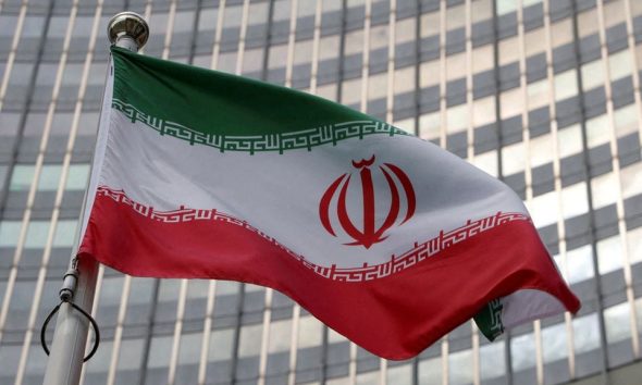 The Iranian flag flutters in front of the International Atomic Energy Agency (IAEA) organisation's headquarters in Vienna, Austria, June 5, 2023. REUTERS/Leonhard Foeger/File Photo