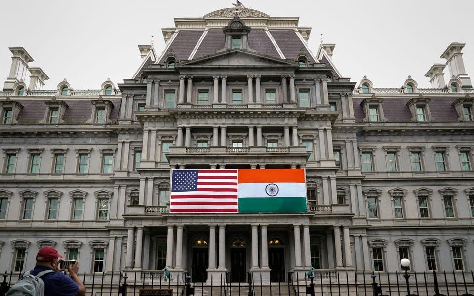 The flags of the United States and India are displayed on the Eisenhower Executive Office Building at the White House in Washington, U.S., June 21, 2023. REUTERS/Elizabeth Frantz/File photo