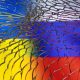 Ukraine and Russian flags are seen through broken glass in this illustration taken March 1, 2022. REUTERS/Dado Ruvic/Illustration/File Photo