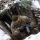 A Ukrainian soldier holds AK-47 rifle in a trench during Combined Arms Training in Wedrzyn, Poland, December 7, 2023. REUTERS/Kuba Stezycki