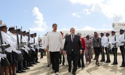 Venezuela's President Nicolas Maduro walks next to St. Vincent and the Grenadines' Prime Minister Ralph Gonsalves as he arrives for a meeting with Guyanese President Irfaan Ali amid tensions over a border dispute, in Kingstown, St. Vincent and the Grenadines December 14, 2023. Miraflores Palace/Handout via REUTERS
